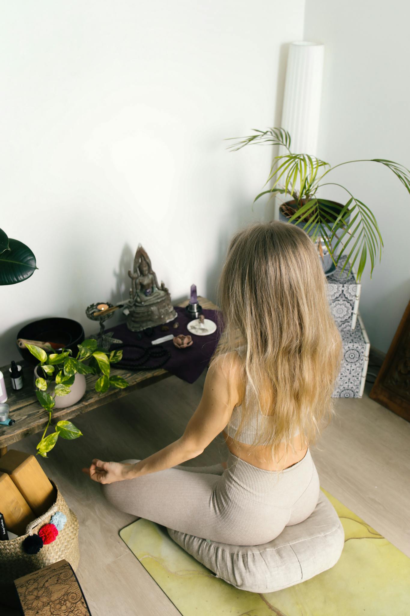 Your Consciousness Corner 6 a woman meditates in a calm indoor